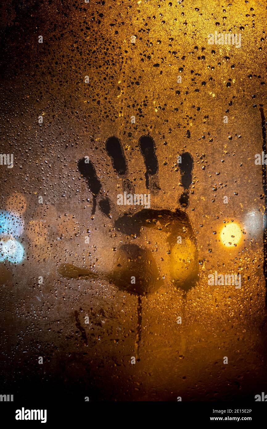 Hand print on a frozen glass Stock Photo