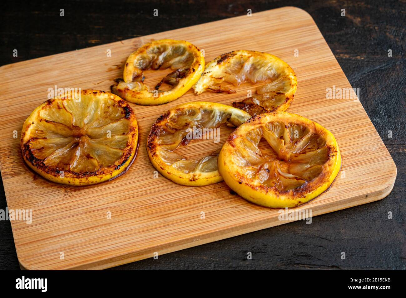 Charred Lemon Slices: Slices of caramelized citrus fruit Stock Photo