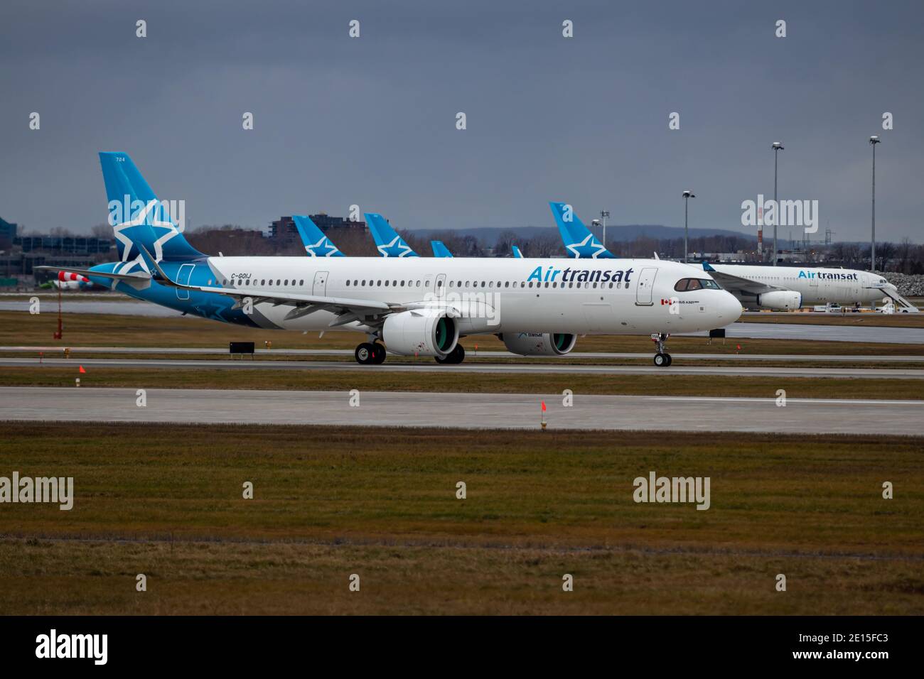 Montreal, Quebec, Canada - 12-13-2020 : Air Transat Airbus A321 NEO taxiing for take off. While most of the the Air transat fleet grounded as seen in Stock Photo