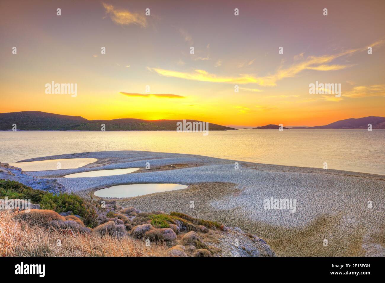 The sunset at the beach Megali Ammos of Marmari in Evia, Greece Stock Photo