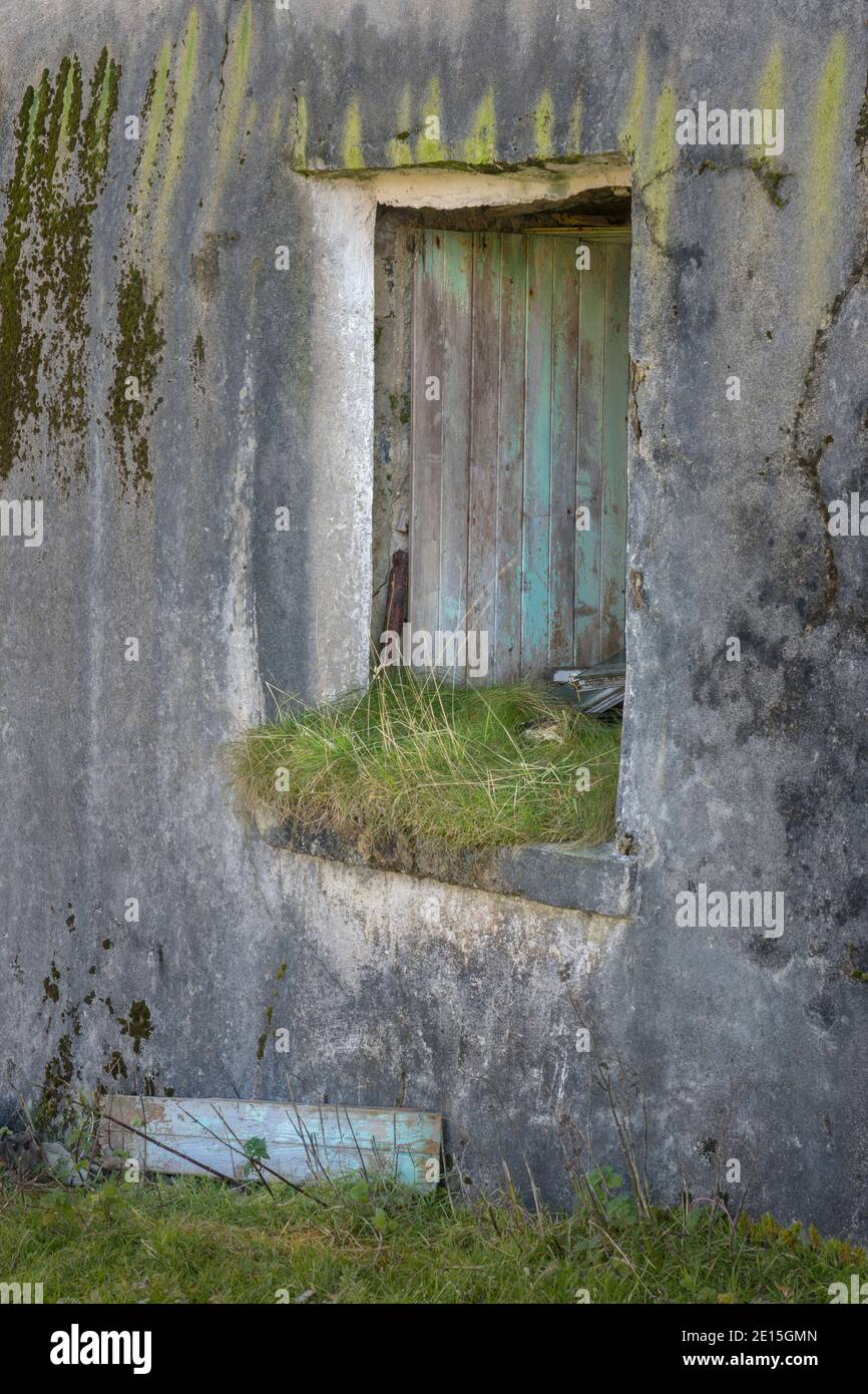 Isle of Lewis and Harris, Scotland: Window on an abandoned croft house with textured walls Stock Photo