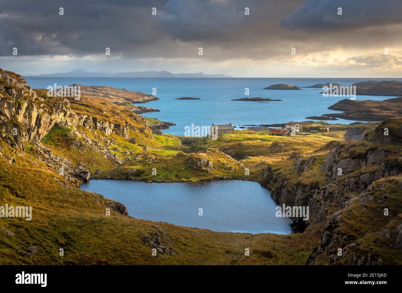South Harris, Isle of Lewis and Harris, Scotland: Clearing evening storm clouds over an isolated coastal village Stock Photo