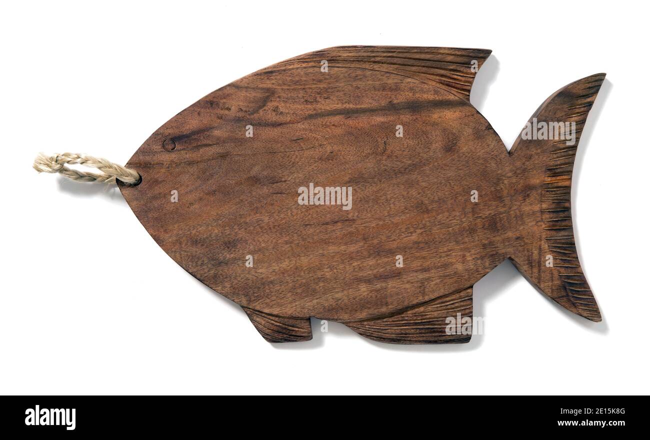 Wooden carved decorative fish from ED by Ellen fashion line by Ellen Degeneres photographed on a white background Stock Photo