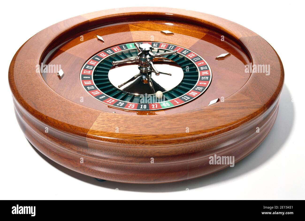 Wooden roulette wheel photographed on a white background Stock Photo