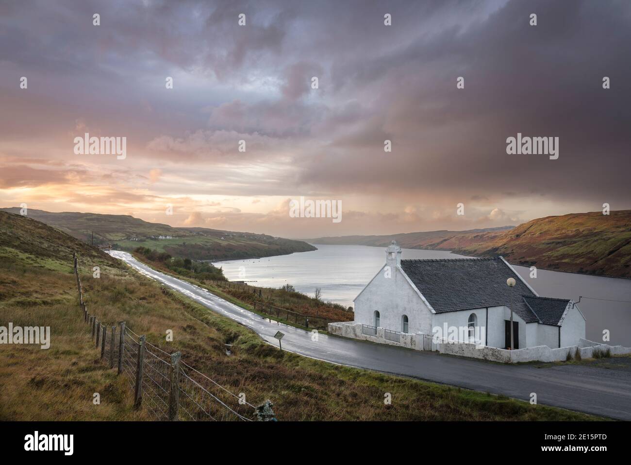 Carbost, Isle of Skye, Scotland: Church and clearing storm at dusk, Loch Harport Stock Photo