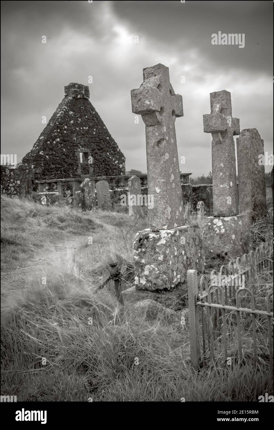 Isle of Skye, Dunvegan, Scotland: Stone celtic corsses in the Old St Mary's Church yard under stormy skies Stock Photo