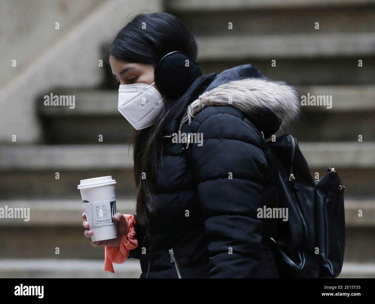 New York, United States. 04th Jan, 2021. Pedestrians wear face masks to protect from and to prevent the spread of COVID-19 as they walk on Wall Street in New York City on Monday, January 4, 2021. Over 15 million coronavirus vaccine doses have been distributed in the US so far. Photo by John Angelillo/UPI Credit: UPI/Alamy Live News Stock Photo