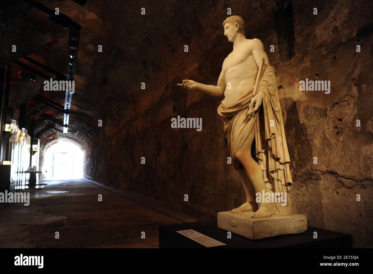 A marble statue of a youth in heroic pose, so-called Britannicus is pictured in the Neronian Cryptoporticus in Rome, Italy on april 12,2011.The exhibit 'Nerone', examining the life and dark legends of Emperor Nero (37-68 AD), opens in Rome across five different landmarks of the ancient imperial capital. Nero has been infamous throughout history for tyranny, extravagance, cold-blooded murder, and cruel persecution of Christians. Ancient Roman historians accused him of killing his mother, stepbrother and two wives, and of burning Christians at night in his garden for firelight. He was known as t Stock Photo