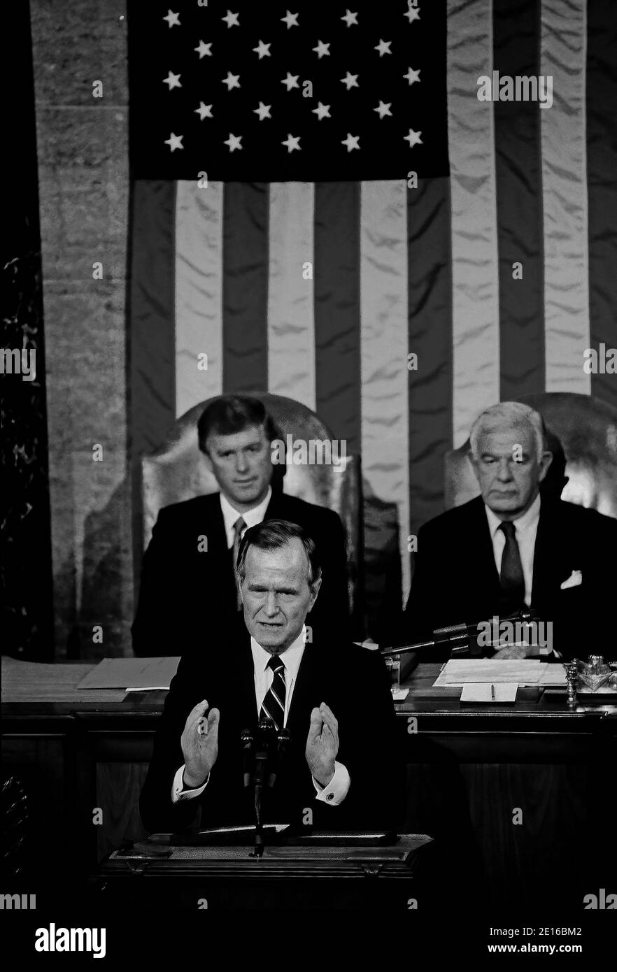 Washington, DC. USA, January 31, 1990 President George H.W. Bush delivers his address Before a Joint Session of the Congress on the State of the Union,Vice President Daniel Quayle and Speaker of the House Tom Foley are seated behind. Stock Photo