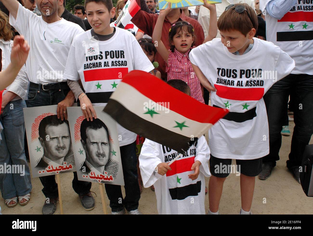 Pro Bachar Al-Assad supporters demonstrate at the Champ de Mars in Paris, France, May 8, 2011, as Syrian security forces have moved into parts of the city of Homs, a centre of the nationwide protests against President Bashar al-Assad. Photo by Alain Apaydin/ABACAPRESS.COM Stock Photo