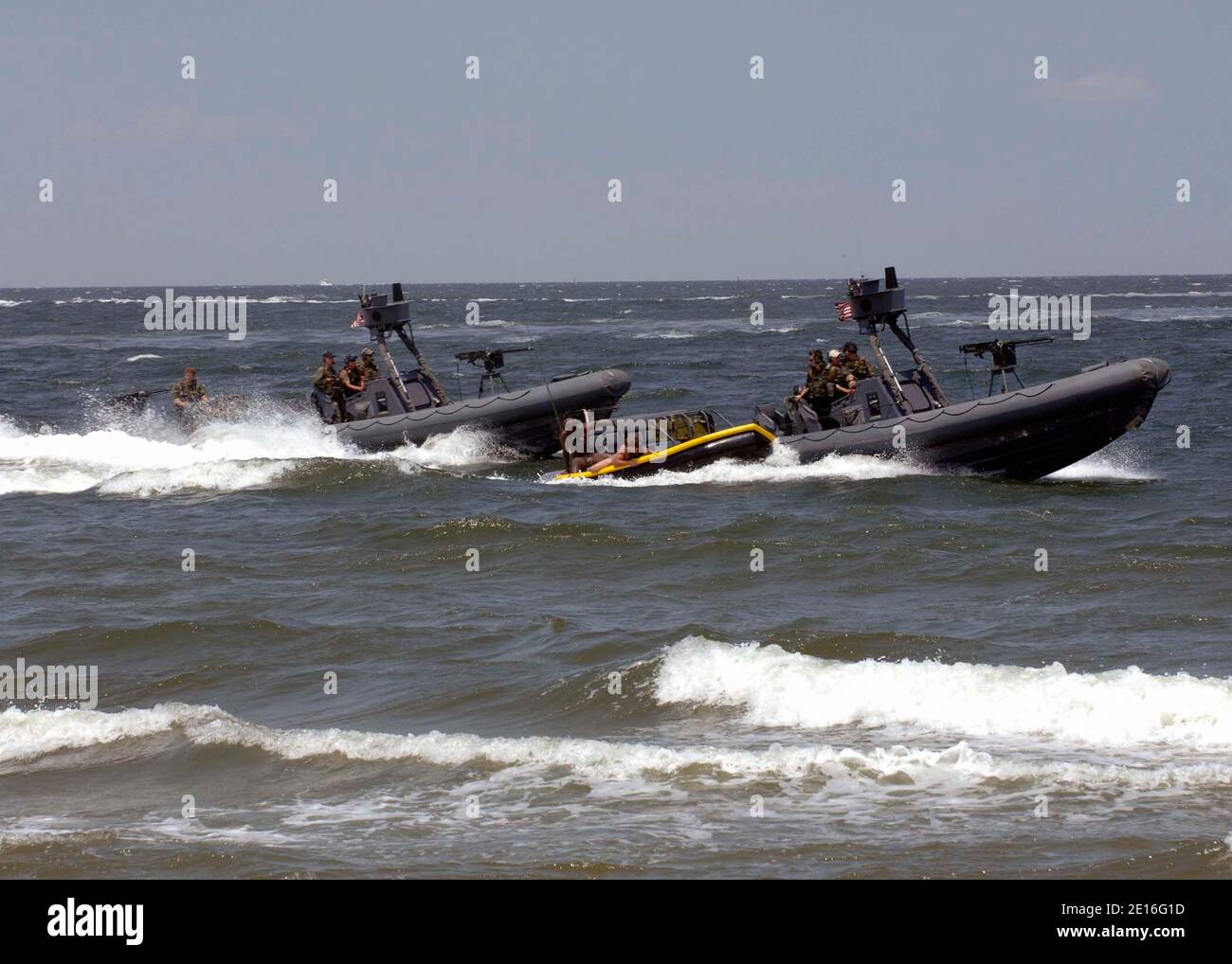 Navy SEALs are extracted from the waters of the Chesapeake Bay into a sling boat being pulled by a rigid hull inflatable boat (RHIB) during a capabilities demonstration at Naval Amphibious Base Little Creek. The Naval Special Warfare community displayed its capabilities as part of the 40th UDT-SEAL East Coast Reunion celebration. Events are planned throughout the weekend to honor UDT/SEAL history, heritage, and families. Photo by USN/ABACAPRESS.COM Stock Photo