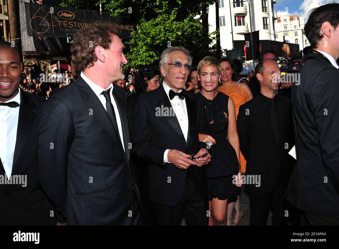 (L-R) Jean-Paul Rouve, Gerard Darmon and Judith Godreche arriving for the screening of 'The Artist' presented in competition in the Feature Films section as part of the 64th Cannes International Film Festival, at the Palais des Festivals in Cannes, southern France on May 15, 2011. Photo by Hahn-Nebinger-Genin/ABACAPRESS.COM Stock Photo