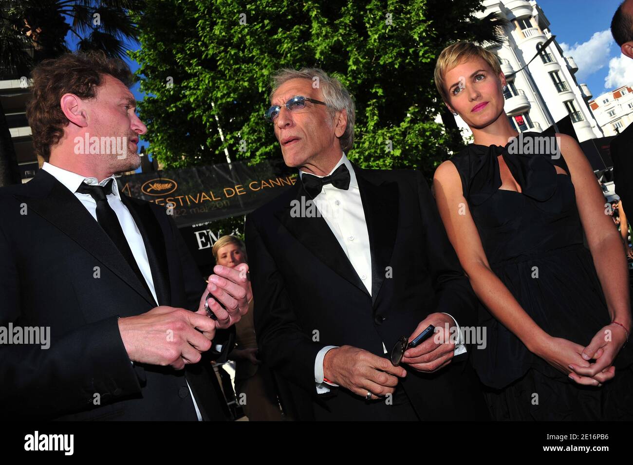 (L-R) Jean-Paul Rouve, Gerard Darmon and Judith Godreche arriving for the screening of 'The Artist' presented in competition in the Feature Films section as part of the 64th Cannes International Film Festival, at the Palais des Festivals in Cannes, southern France on May 15, 2011. Photo by Hahn-Nebinger-Genin/ABACAPRESS.COM Stock Photo