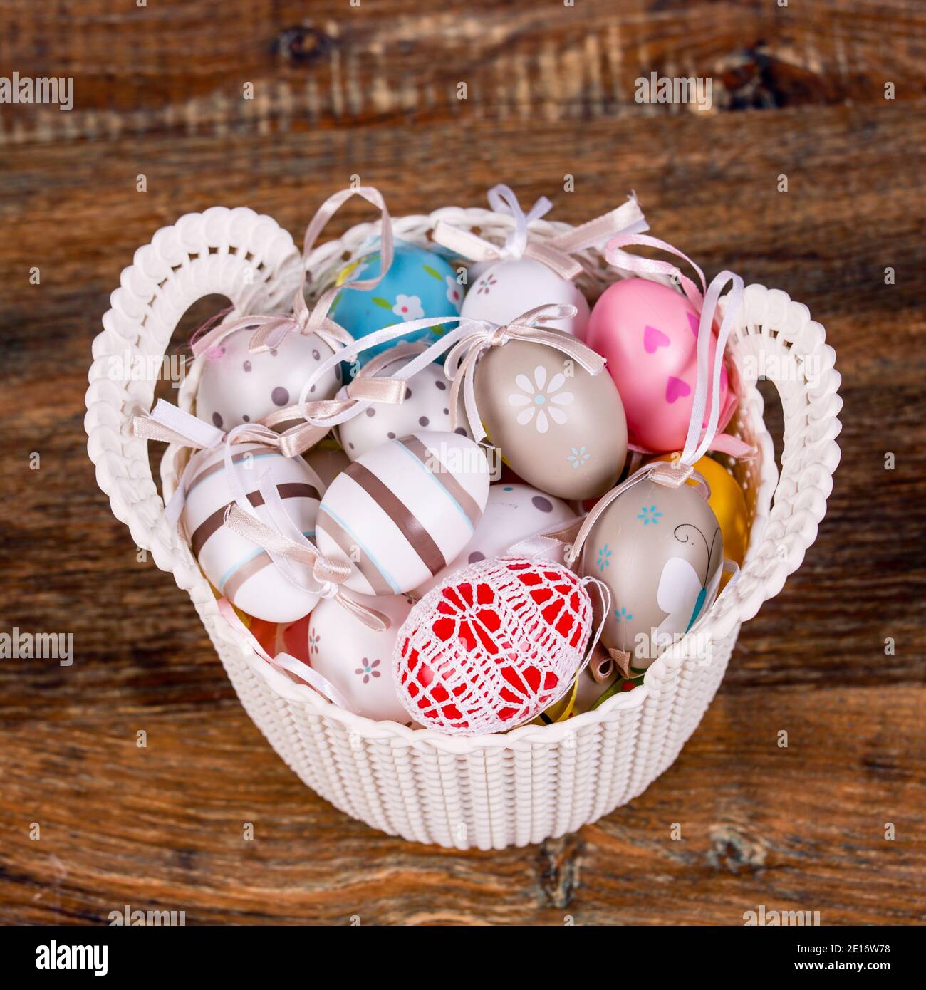 Easter Eggs In White Basket Stock Photo - Alamy