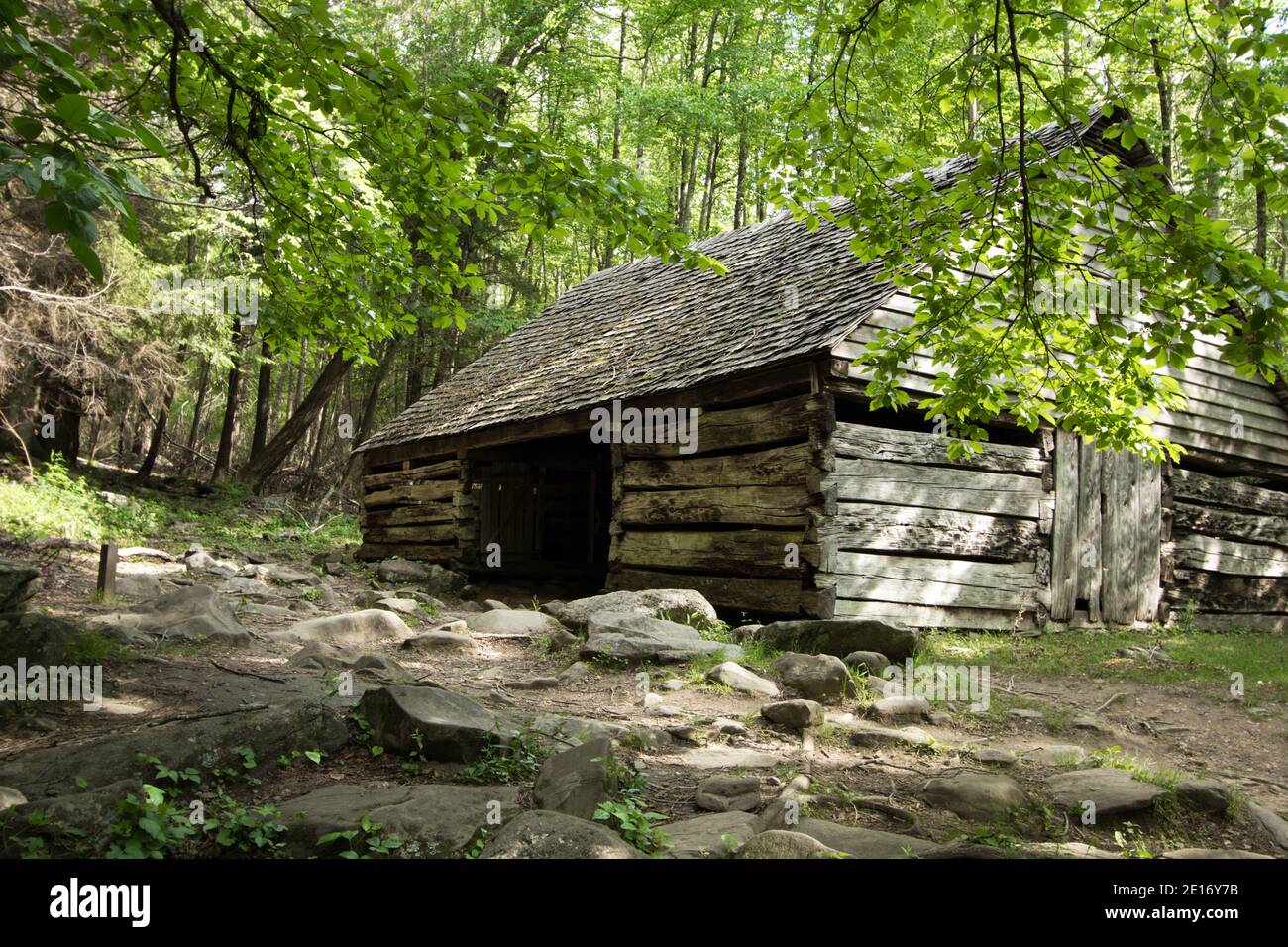Historical wooden barn on display in the Great Smoky Mountains National Park on the Roaring Fork Motor Nature Trail. Gatlinburg, Tennessee. Stock Photo