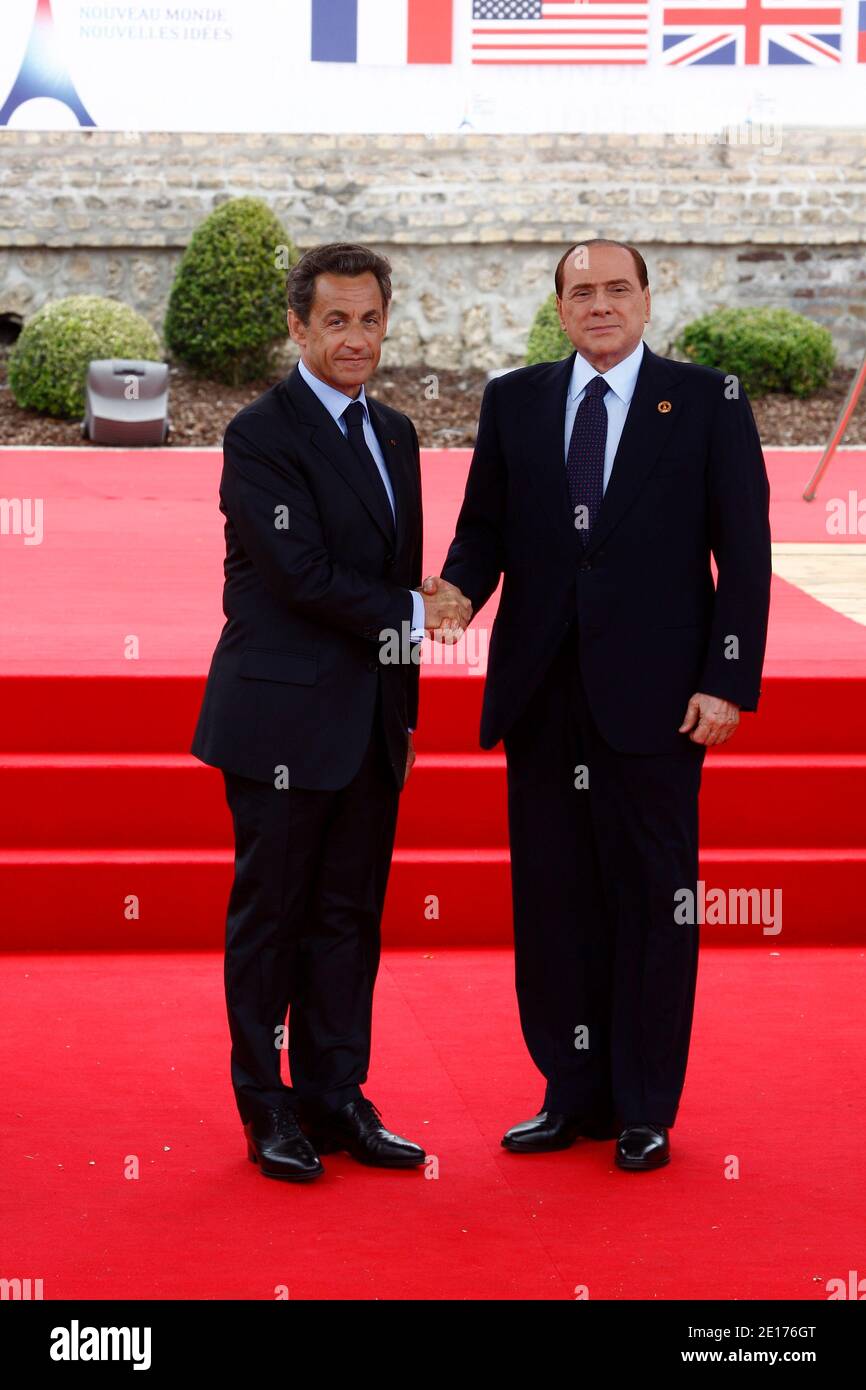 French President Nicolas Sarkozy receives Italian Prime Minister Silvio Berlusconi outside the Villa le Cercle in Deauville, western France, on May 26, 2011, during the G8 summit. G8 leaders meeting in France are to call for an end to the bloody repression of protests in Libya and Syria and for Israel and the Palestinians swiftly to engage in meaningful peace talks. Photo by Ludovic/Pool/ABACAPRESS.COM Stock Photo