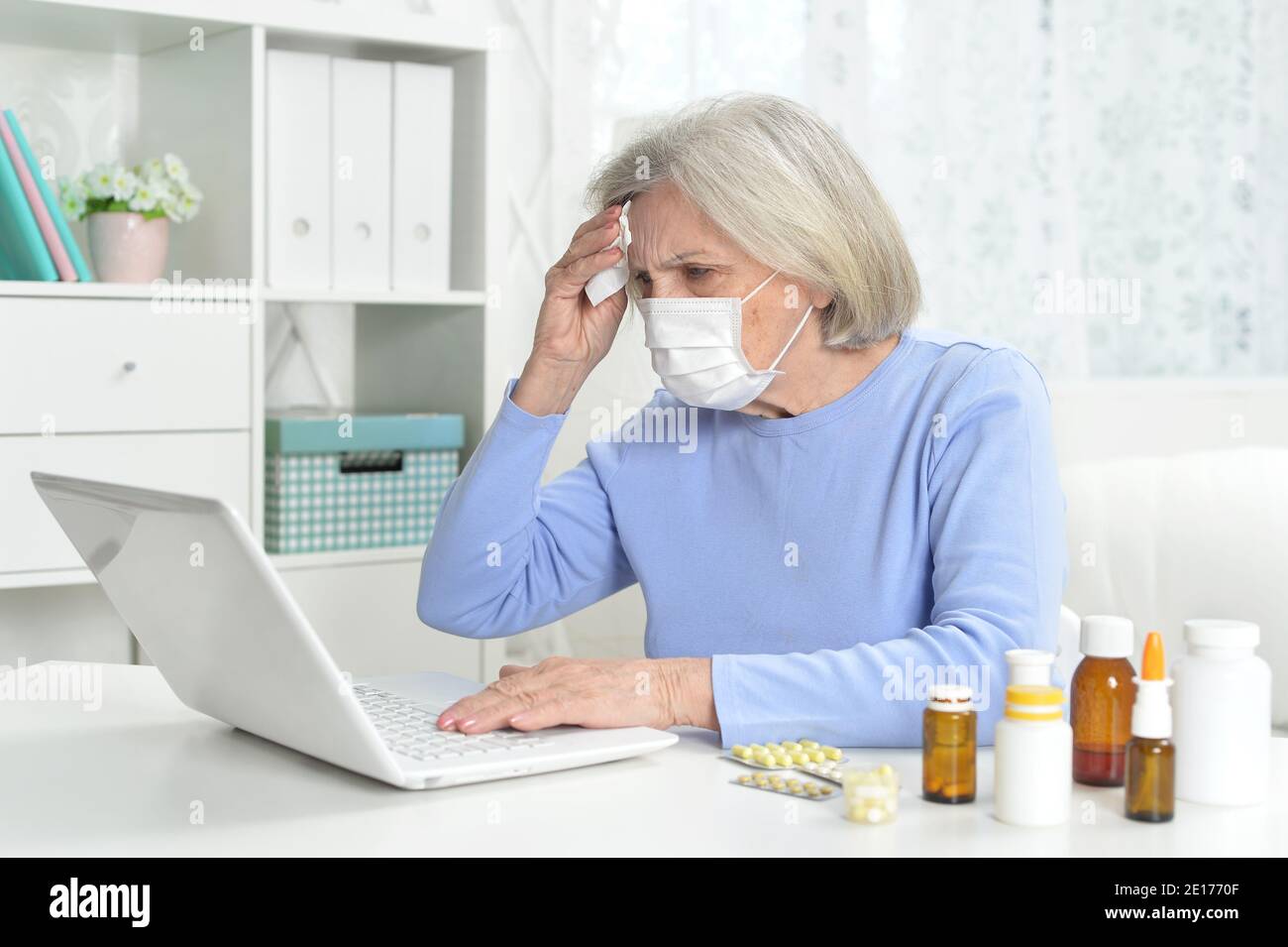 Mature woman wearing facial mask hi-res stock photography and images ...