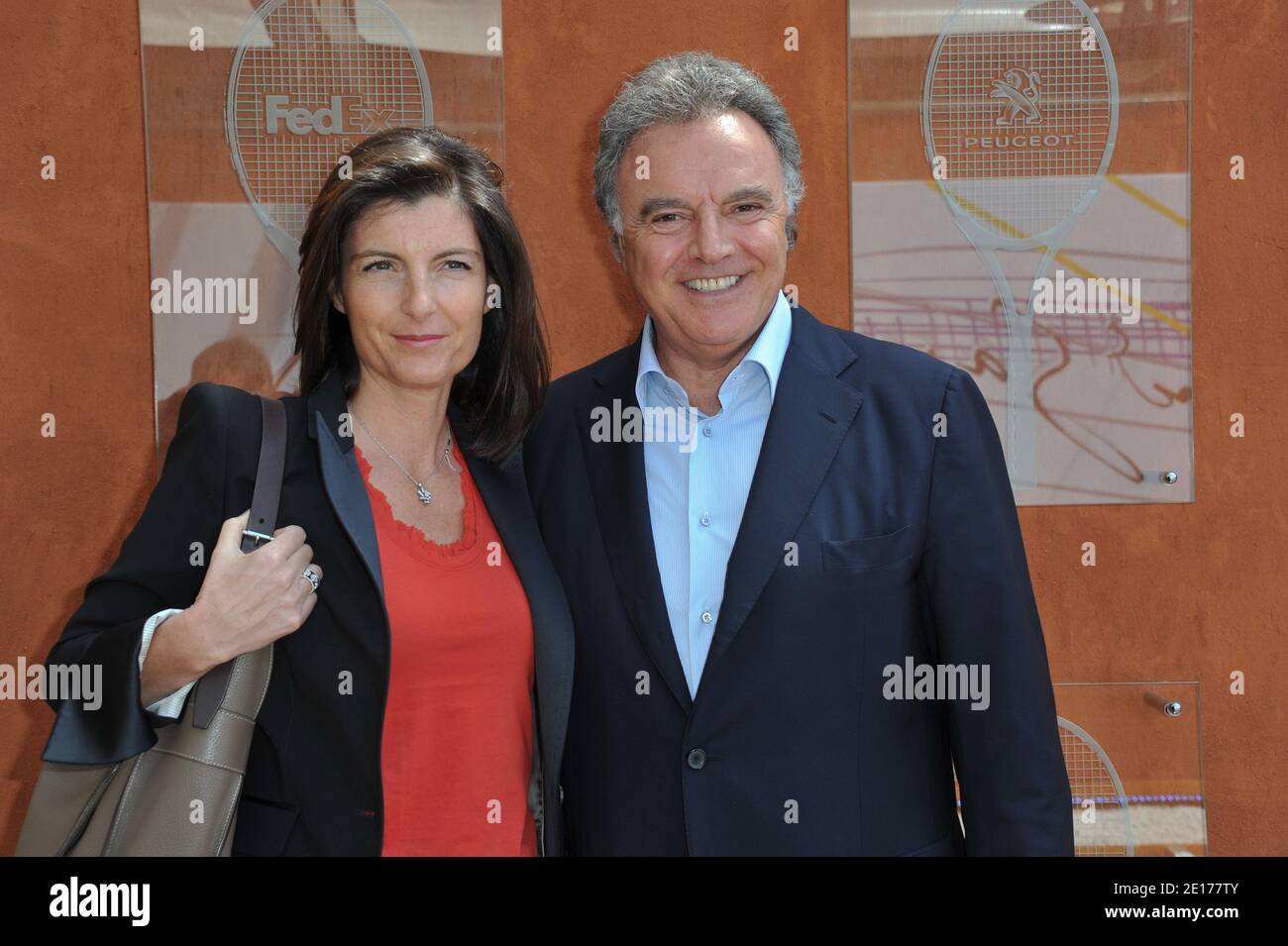 Alain Afflelou and his wife attending the French Tennis Open 2011