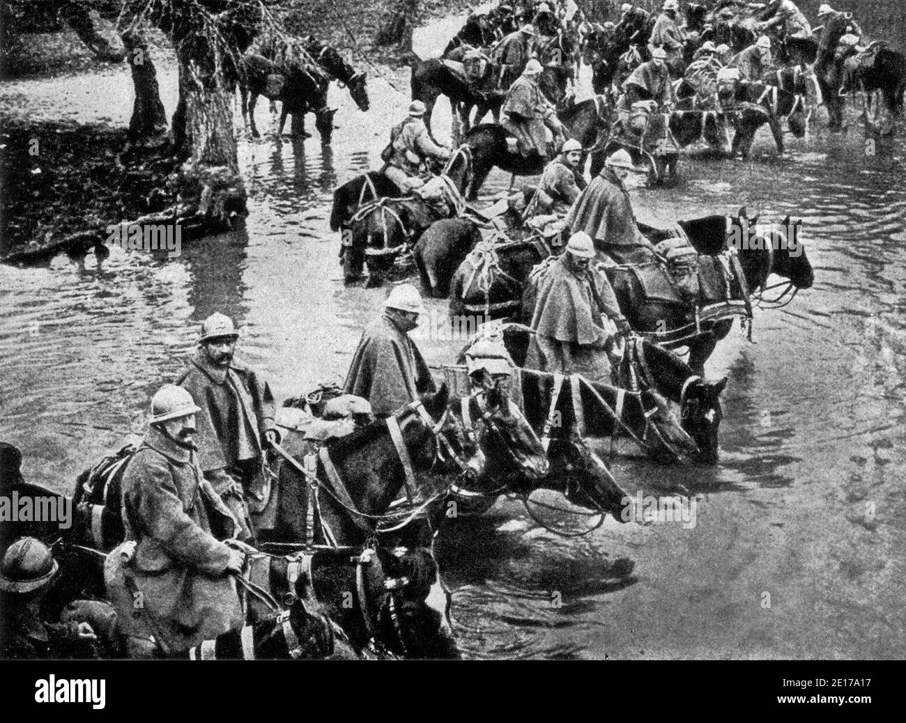 Reserves Crossing a River on the way to Verdun 'They shall not pass' is a phrase which for all time will be associated with the heroic defense of Verdun. To future generations of French people it will bring a thrill of pride even surpassing that enkindled by the glorious 'The Old Guard dies, it never surrenders.' The guardians of the great fortress on the Meuse have proved themselves invincible in attack, invulnerable in defense. Stock Photo