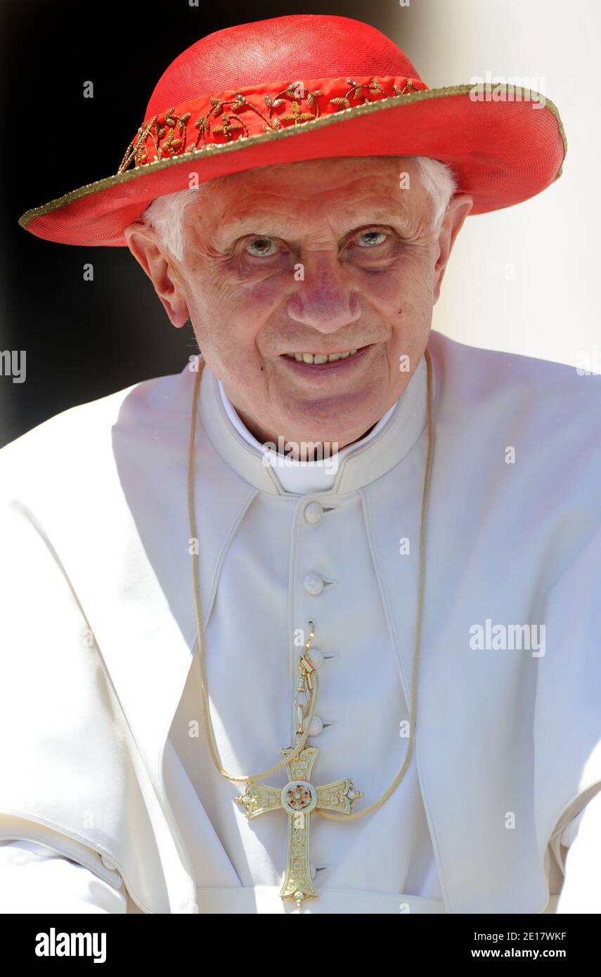 Sunny day in Rome Pope Benedict XVI wears his red Saturn hat, named after the ringed