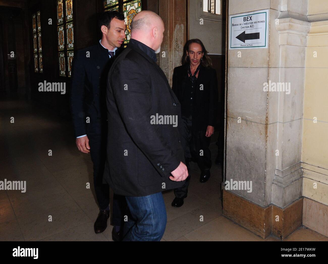 British fashion designer John Galliano and friend Alexis Roche arrive at  the Paris' courthouse, France on June 22, 2011. John Galliano charged with  hurling anti-Semitic slurs in a Paris cafe - allegations