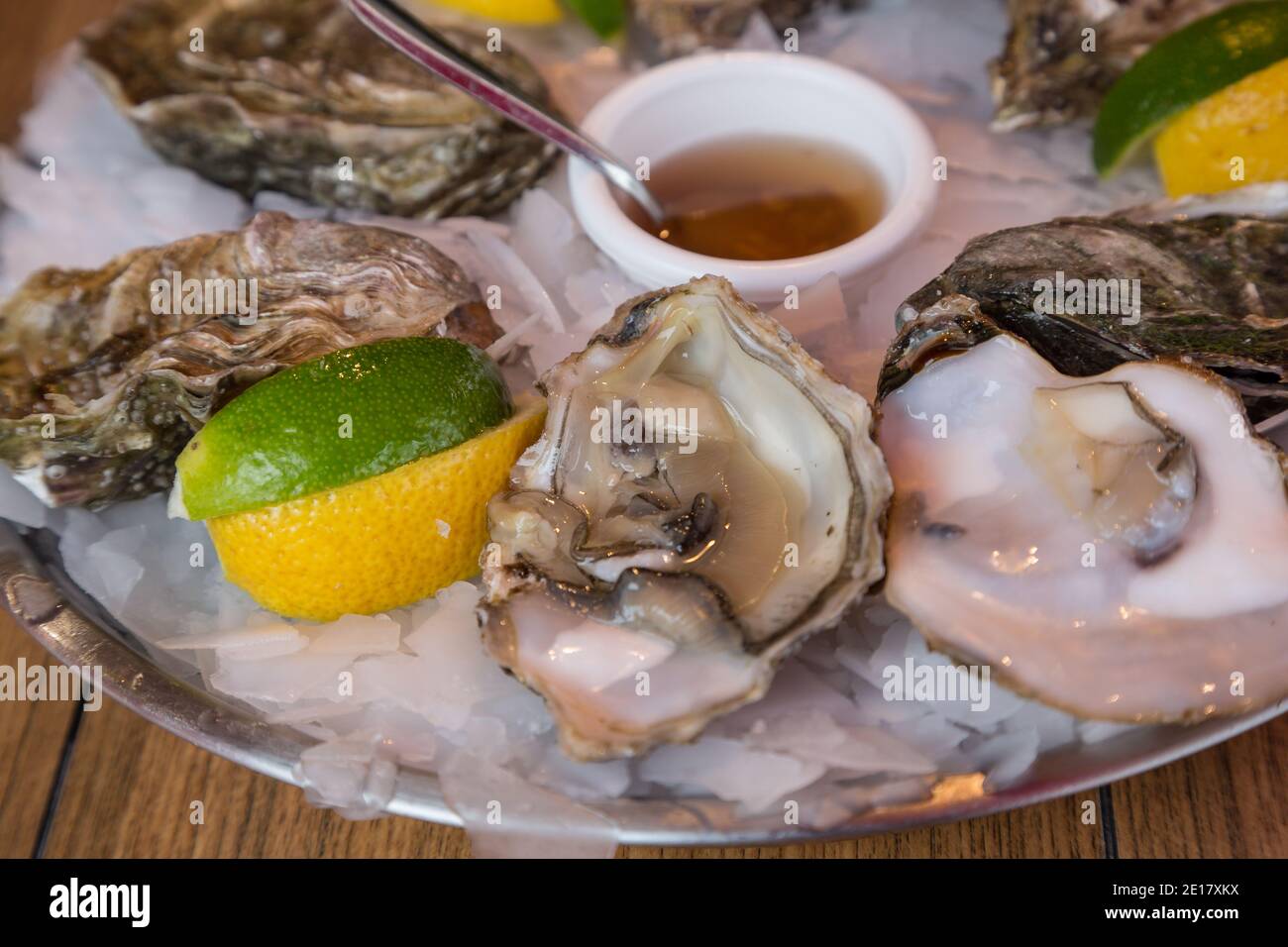 Fresh oysters with lemon and lime cheeks at a market in Normandy