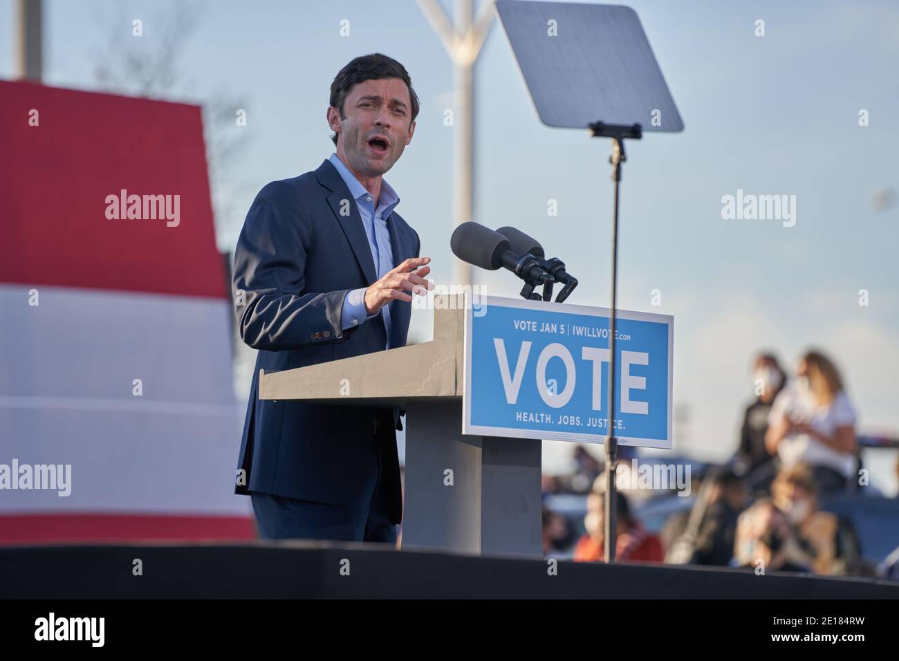 Atlanta, United States. 04th Jan, 2021. Jon Ossoff addresses crowd at drive-in rally on the eve of Georgia's Senate runoff election at Center Parc Credit Union Stadium on January 4, 2021 in Atlanta, Georgia. Credit: Sanjeev Singhal/The News Access/Alamy Live News Stock Photo