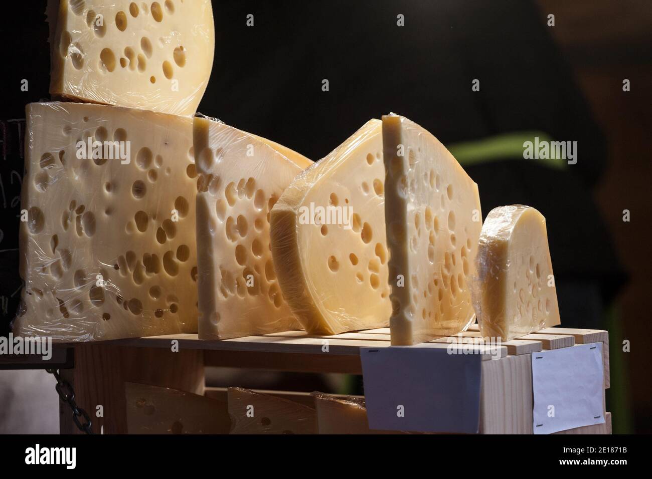 Slices of French and Swiss emmental cheese, wrapped, with their iconic