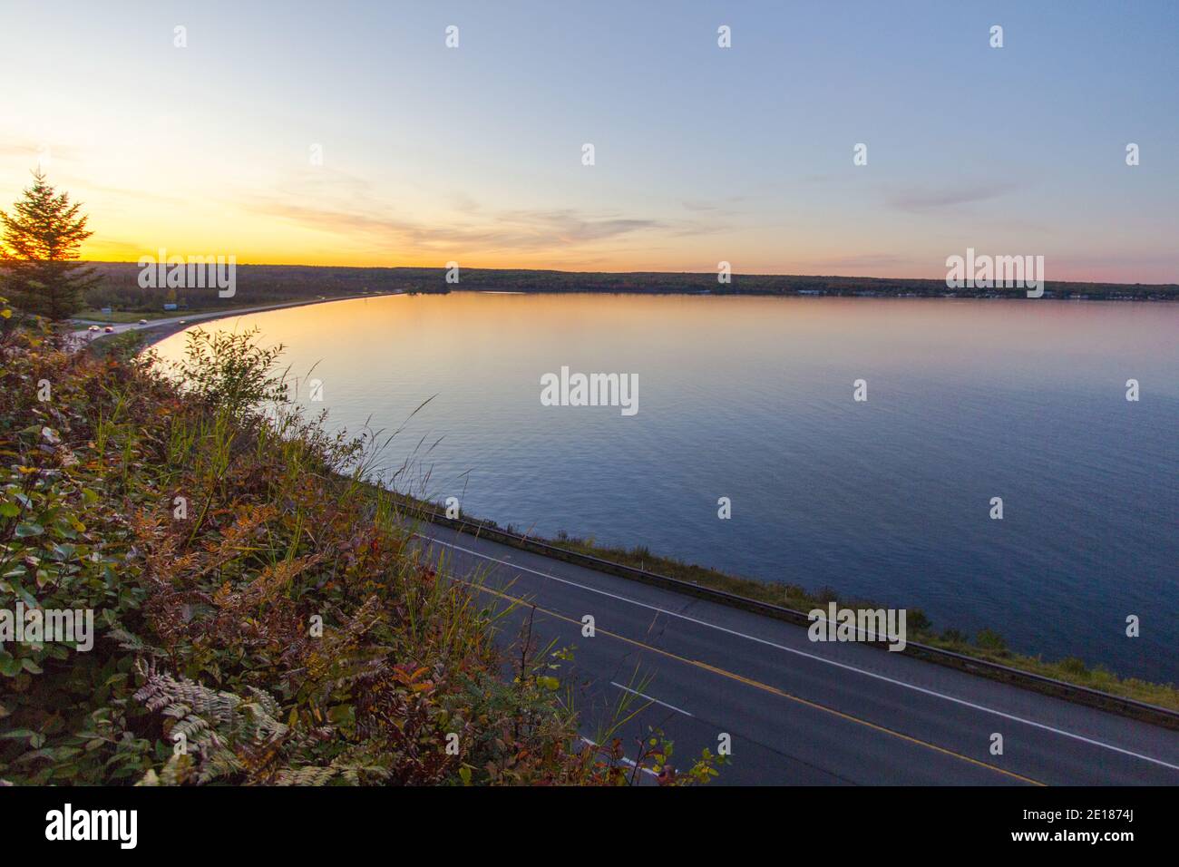 Michigan Scenic Drive. Coastal highway along the Keweenaw Bay of Lake Superior at sunset in the Upper Peninsula of Michigan. Stock Photo