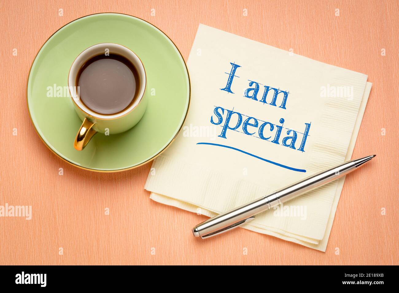 I am special positive affirmation, handwriting on a napkin with a cup