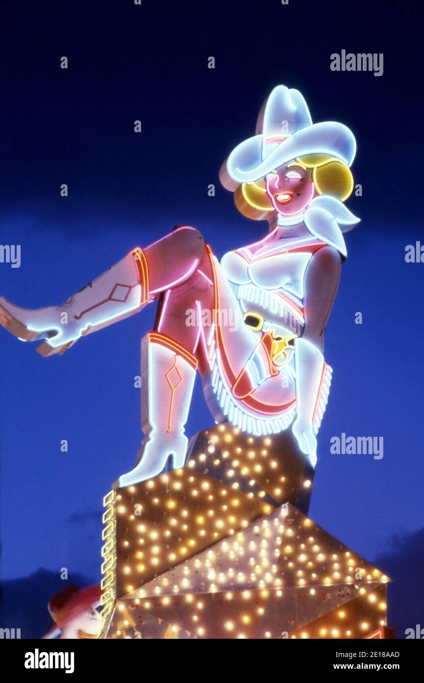 Iconic Cowgirl neon sign on Fremont Street in Las Vegas, NV Stock Photo