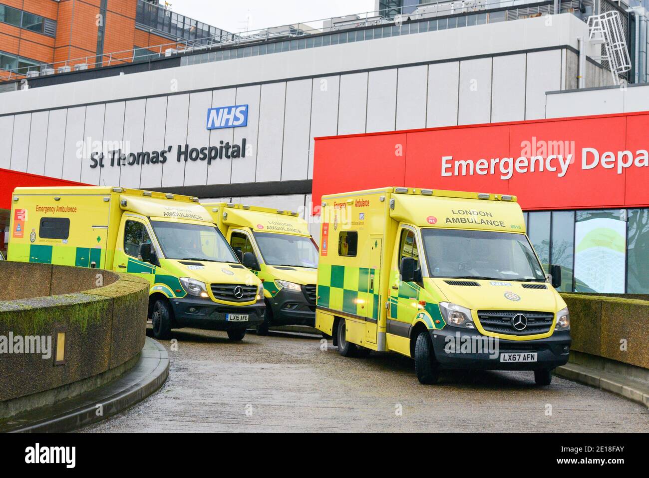 Ambulances park outside St Thomas Hospital in London. Stock Photo