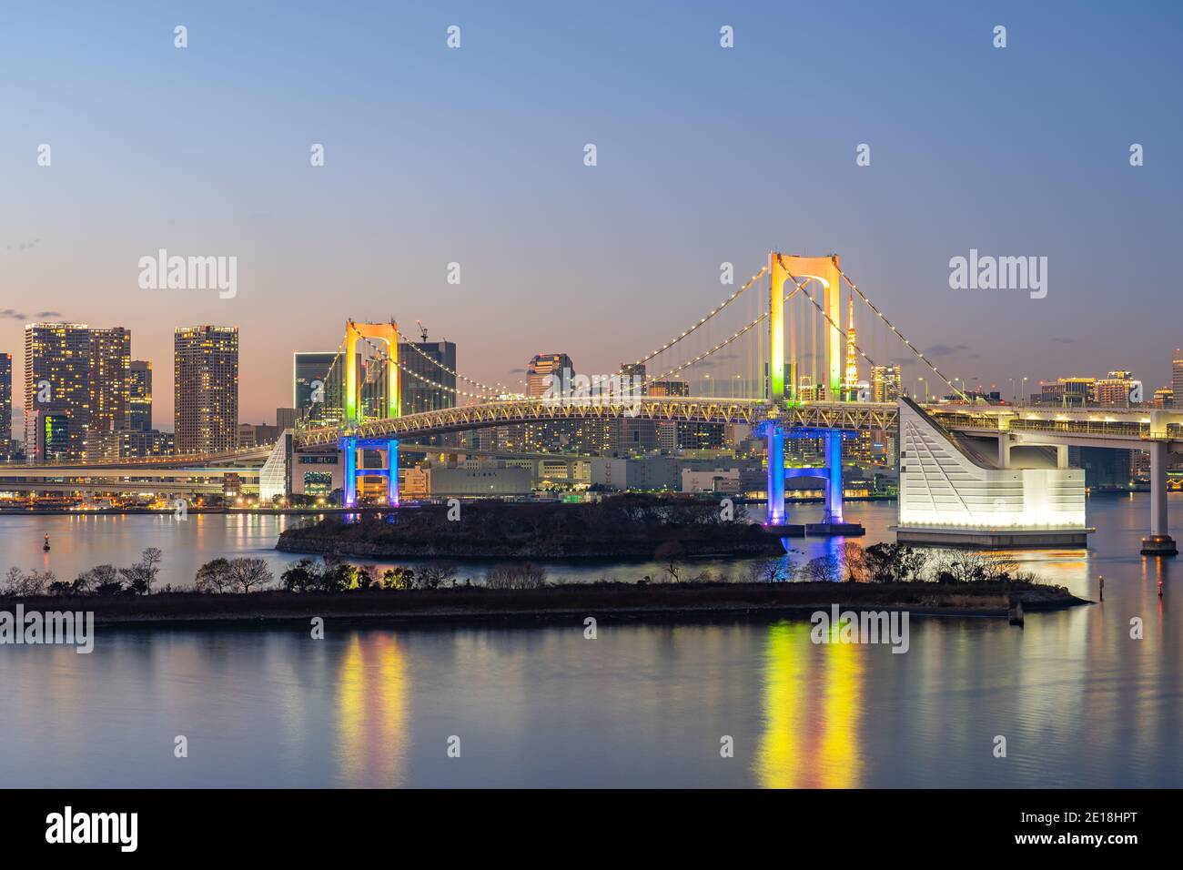 Tokyo bay at night with Rainbow bridge in Tokyo, Japan. Stock Photo