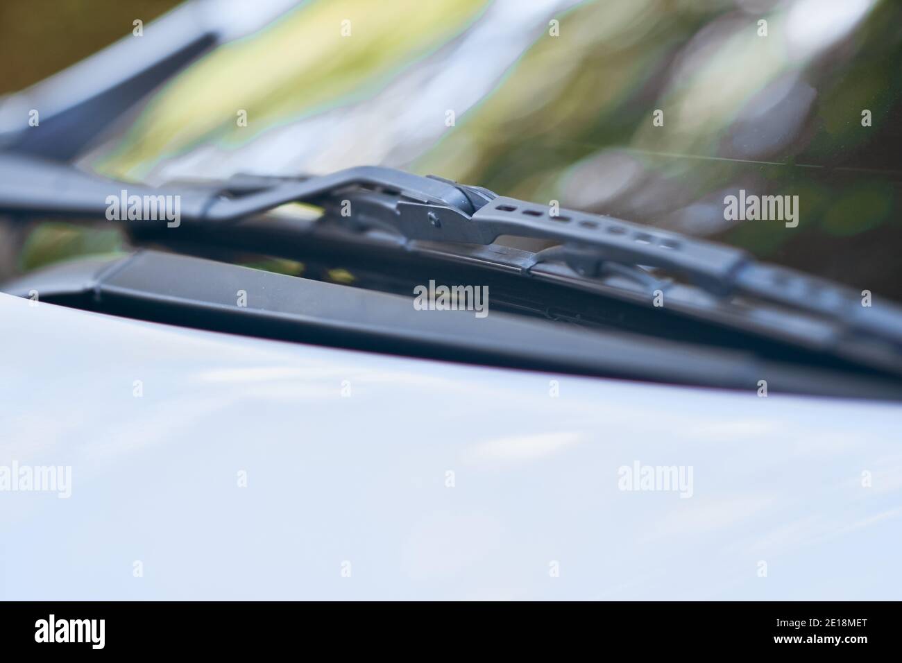 Car wiper on white car parked Stock Photo - Alamy