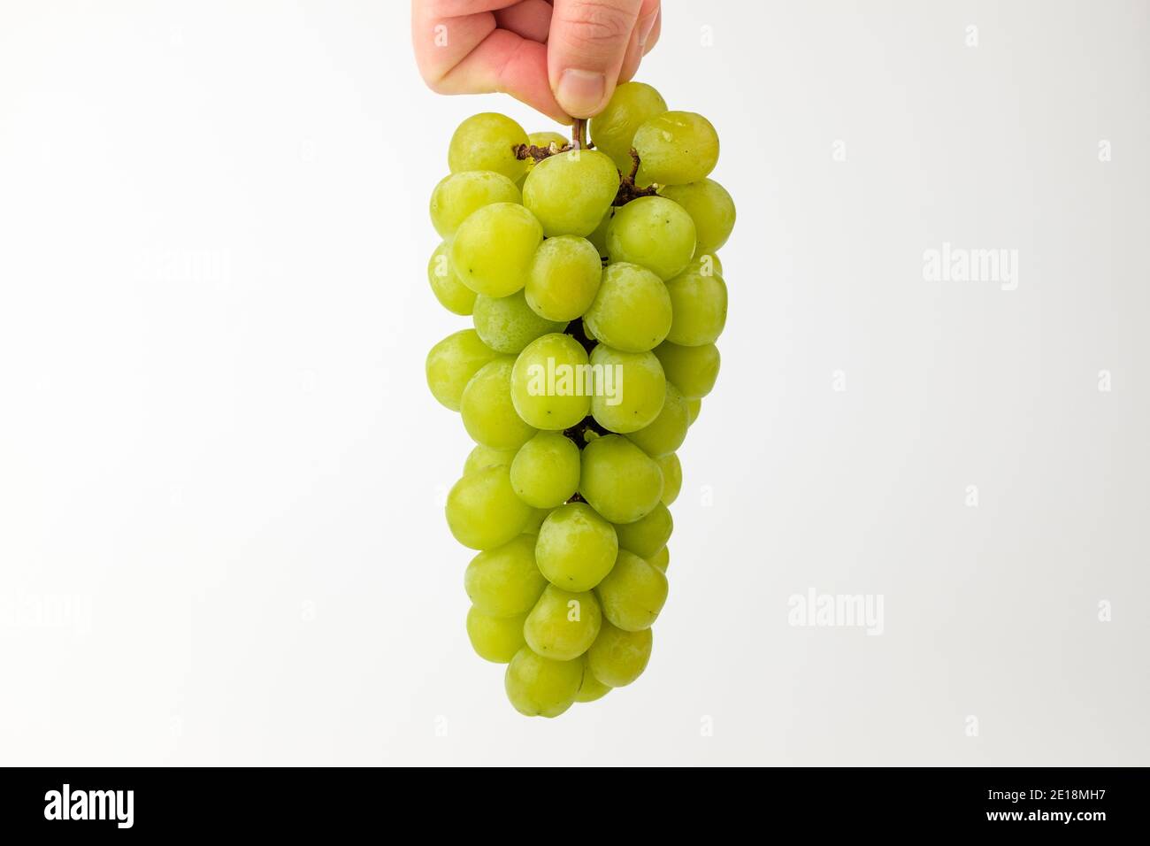Green grapes on white background Stock Photo