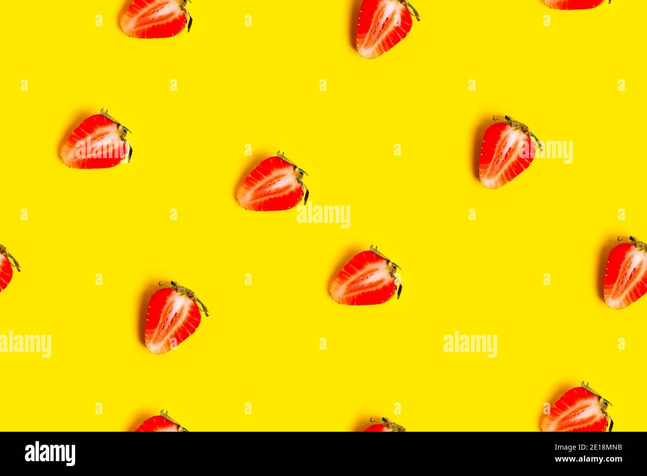 Abstract background with red fresh strawberryes on yellow background. Seamless pattern Stock Photo