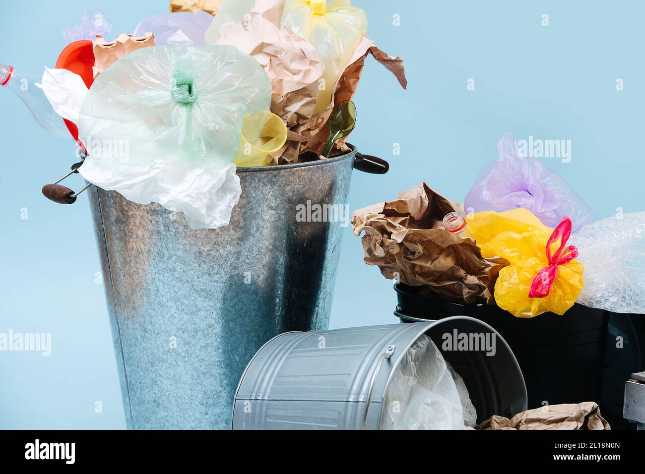 Recycling and ecology concept. Garbage cans filled with recycling waste. Stock Photo