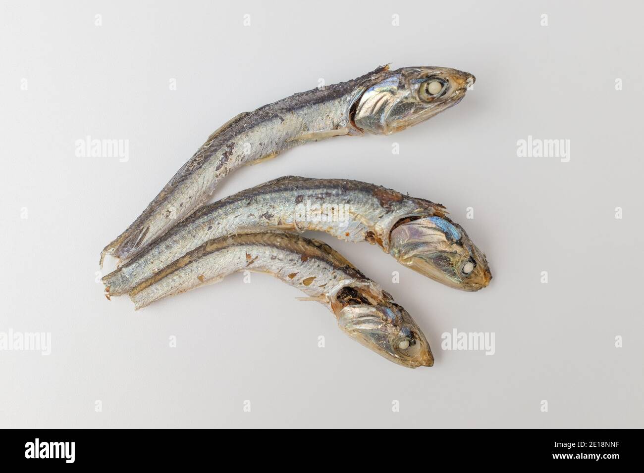 Dry anchovies on white background Stock Photo Alamy