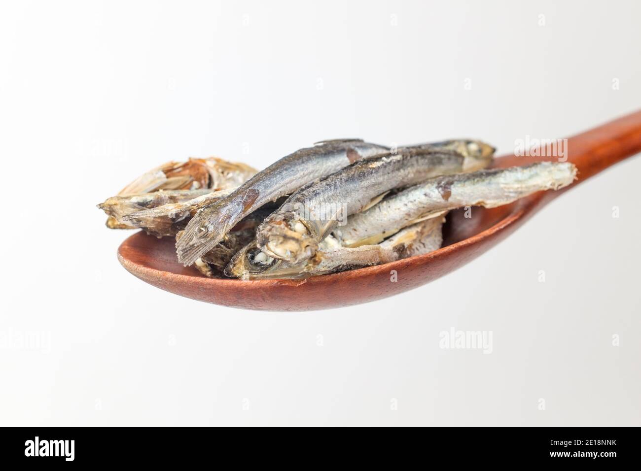 Dry anchovies on white background Stock Photo Alamy