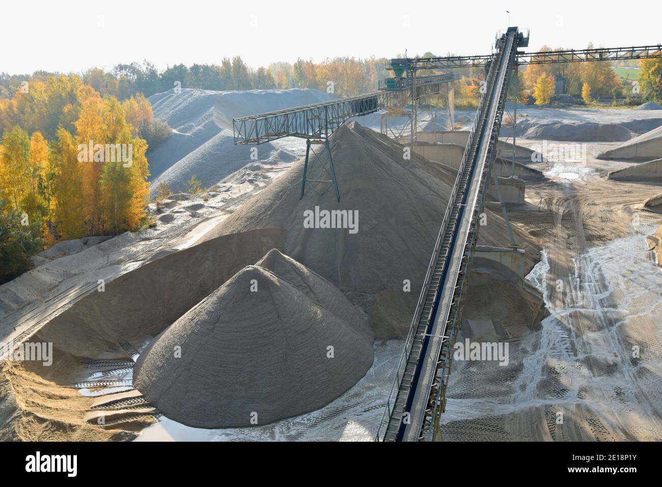 Gravel pit: building and wheel loader loading gravel onto a truck Stock ...