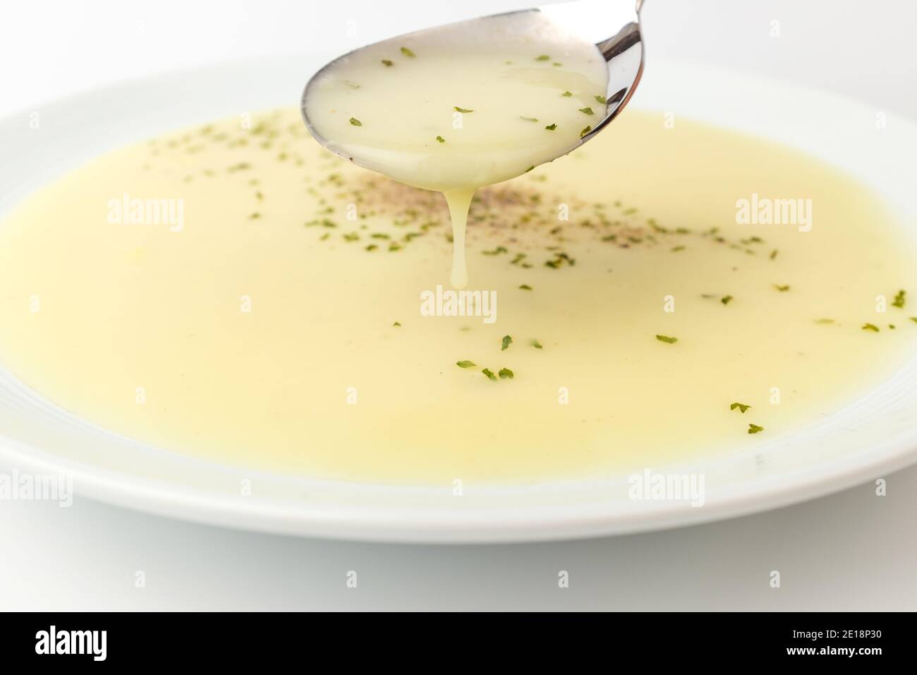 Cream soup on white background Stock Photo - Alamy