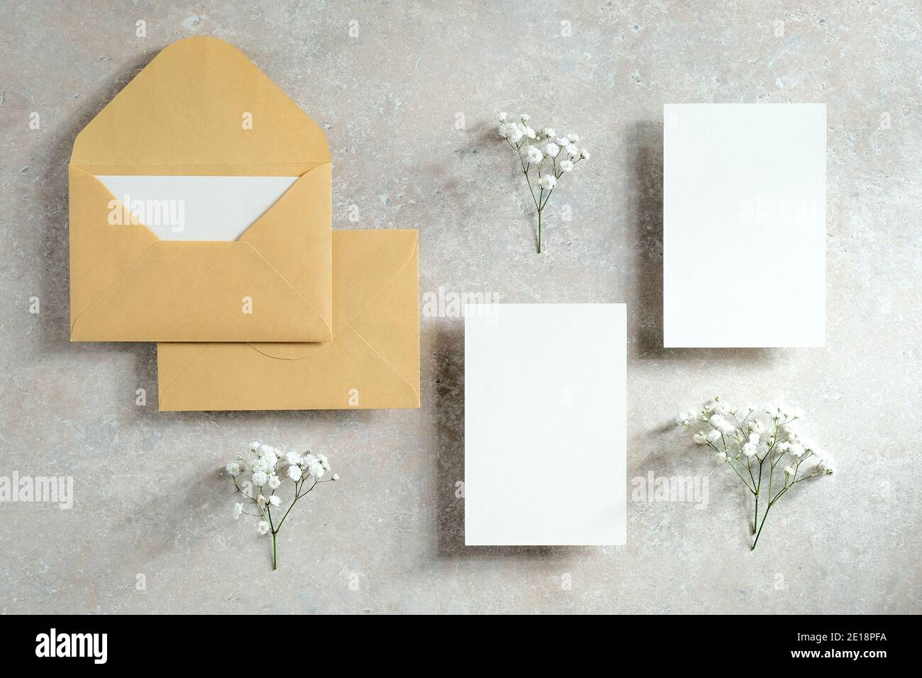 Wedding stationery set on stone table top view. Flat lay blank