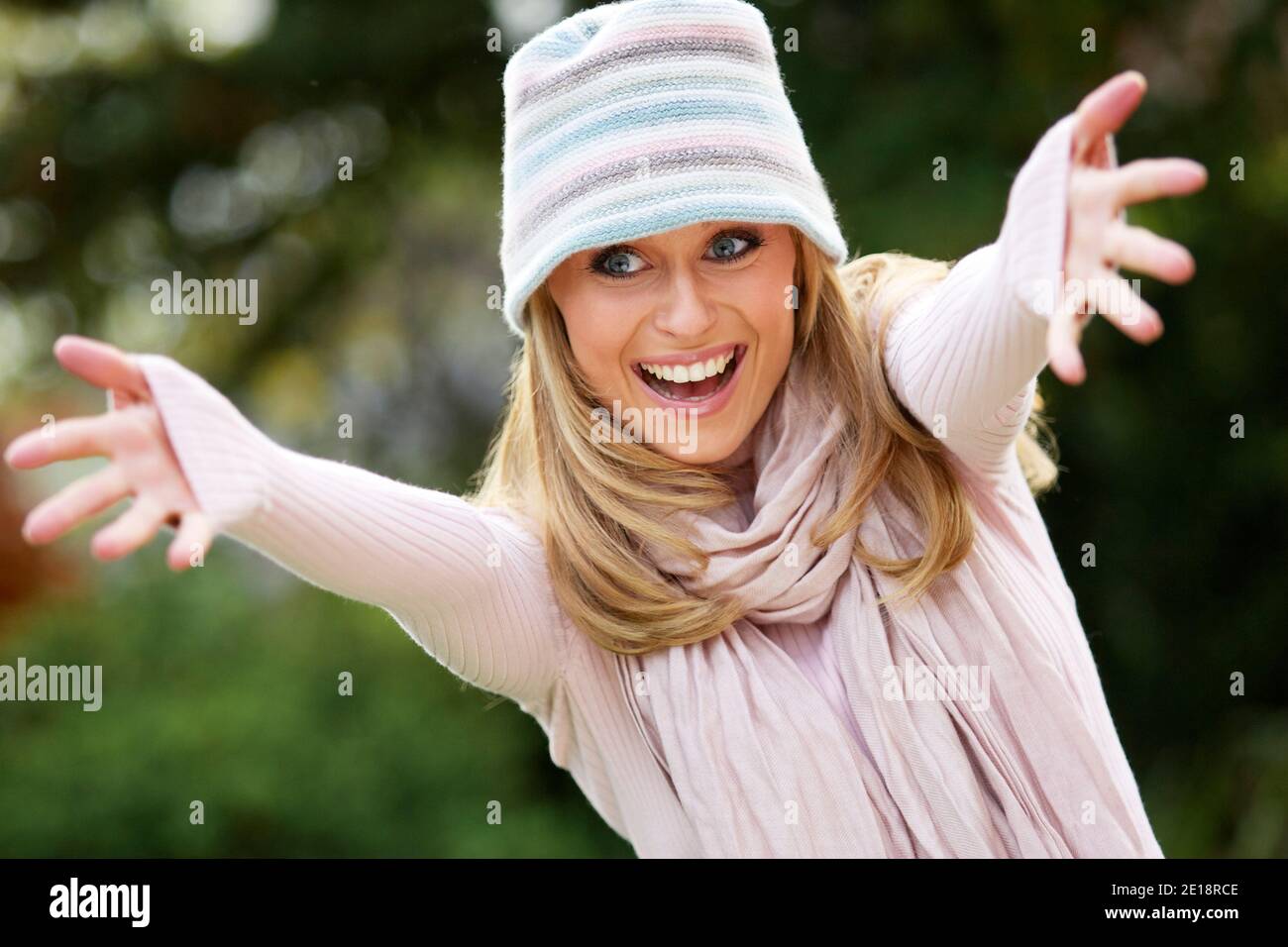 Beautiful woman greeting friends Stock Photo