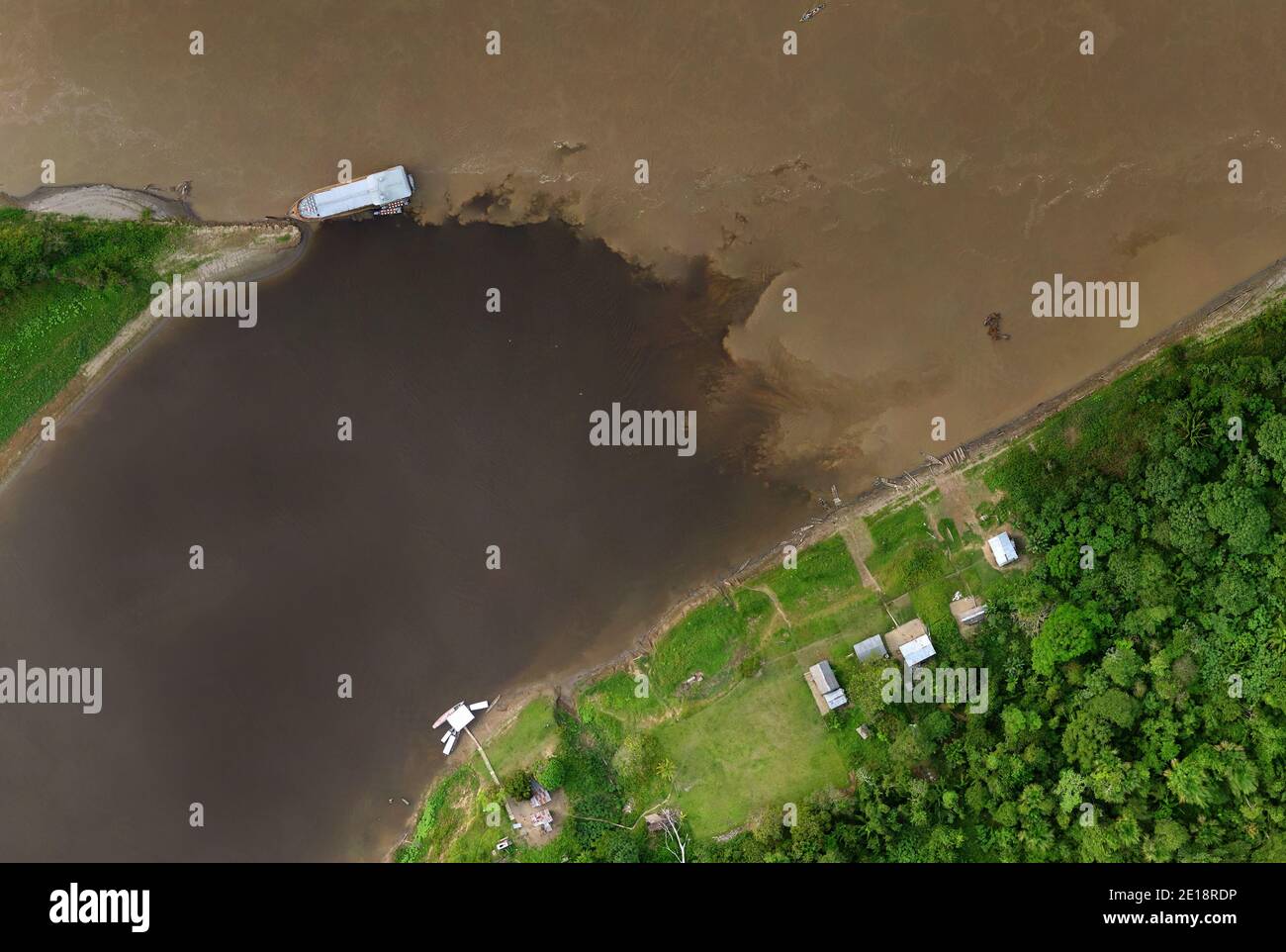 Meeting of Waters aerial drone (Portuguese: Encontro das Águas) at the confluence of two  rivers. Pacaya-Samiria National Reserve, Loreto, Peru. Stock Photo