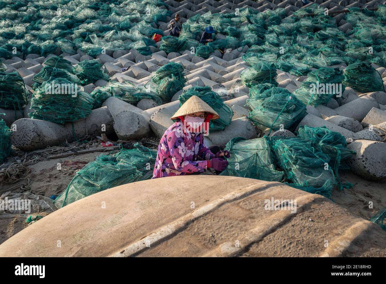 Woman working the nets, Can ca Loc An, Vietnam Stock Photo