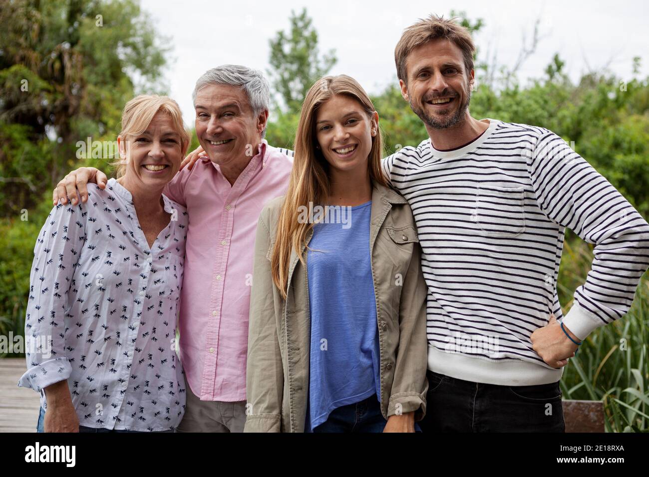 Portrait of happy family standing together Stock Photo Alamy