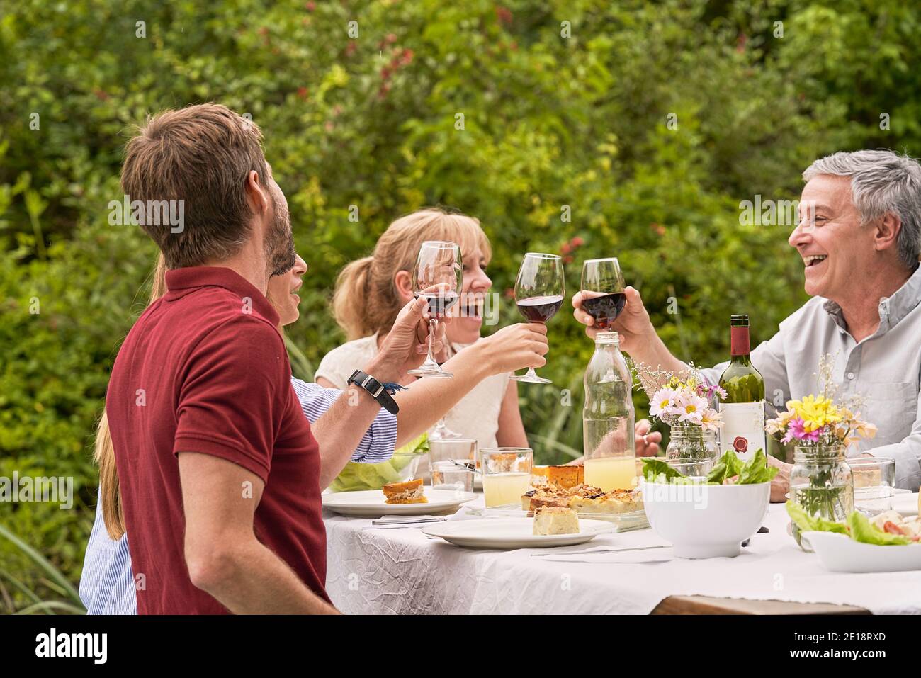 Family having lunch in garden Stock Photo