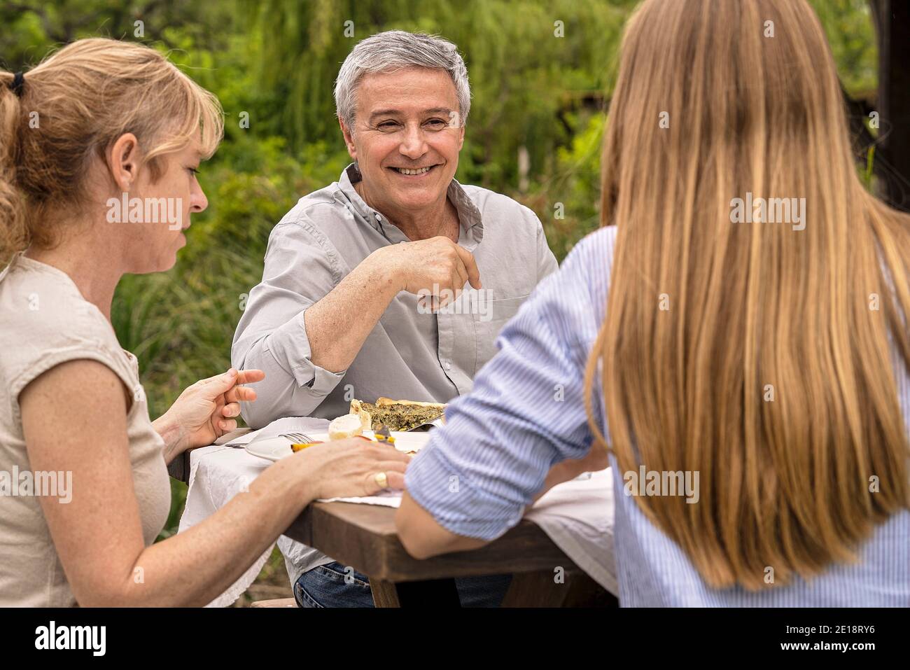 Family having lunch in garden Stock Photo