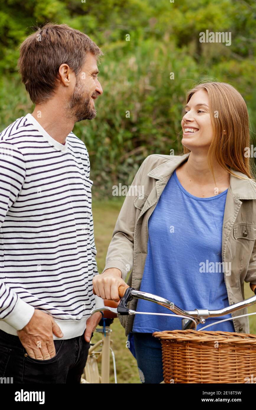 Smiling mid adult couple looking at each other Stock Photo