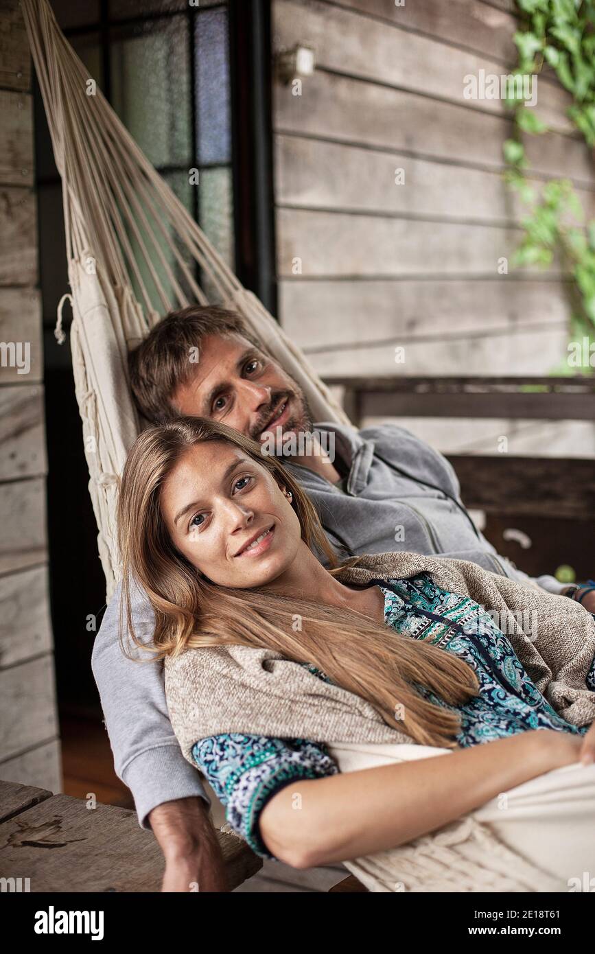 Portrait of couple relaxing in hammock Stock Photo
